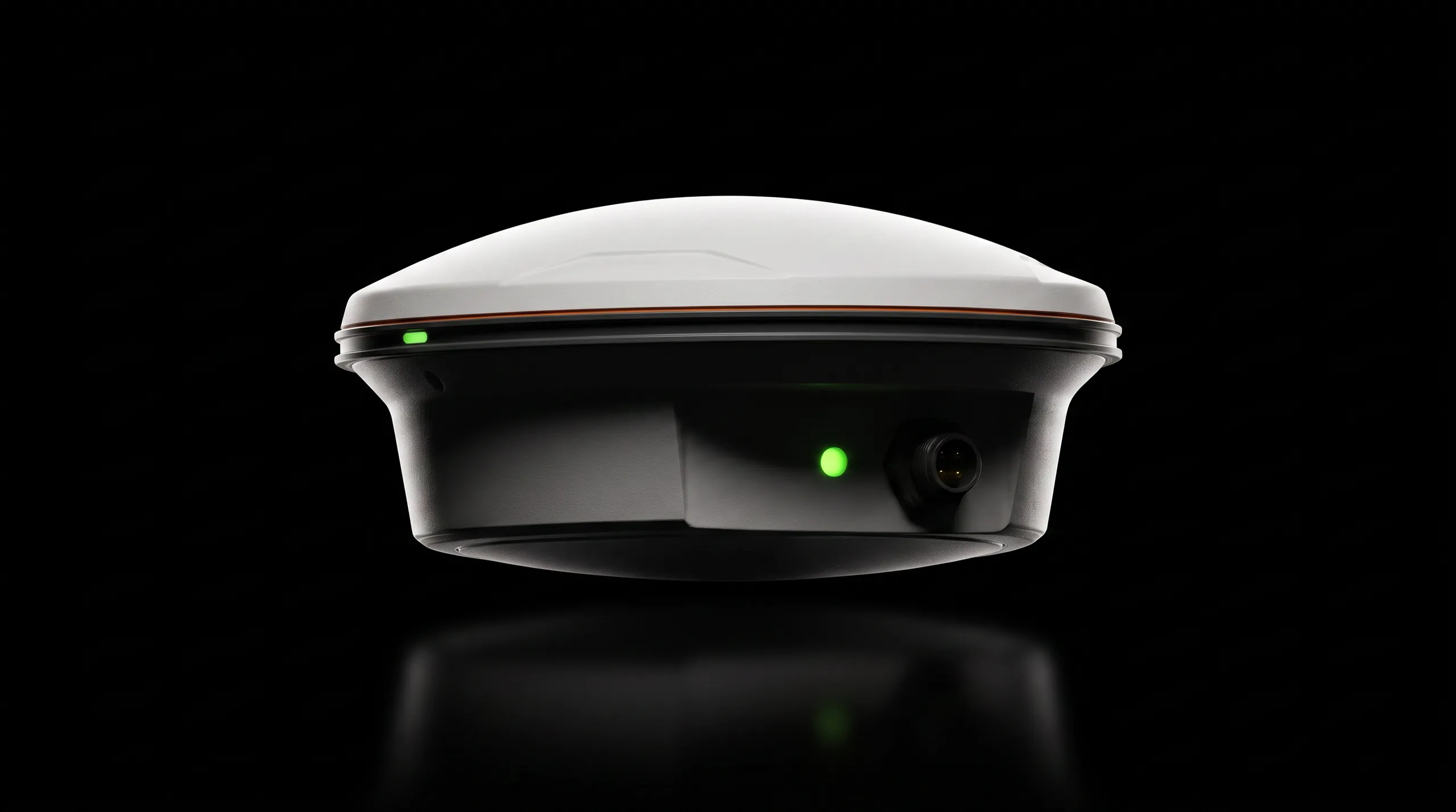 Studio view of the Northing receiver: a low white dome with an orange seam and two green status LEDs, lit from behind on black
